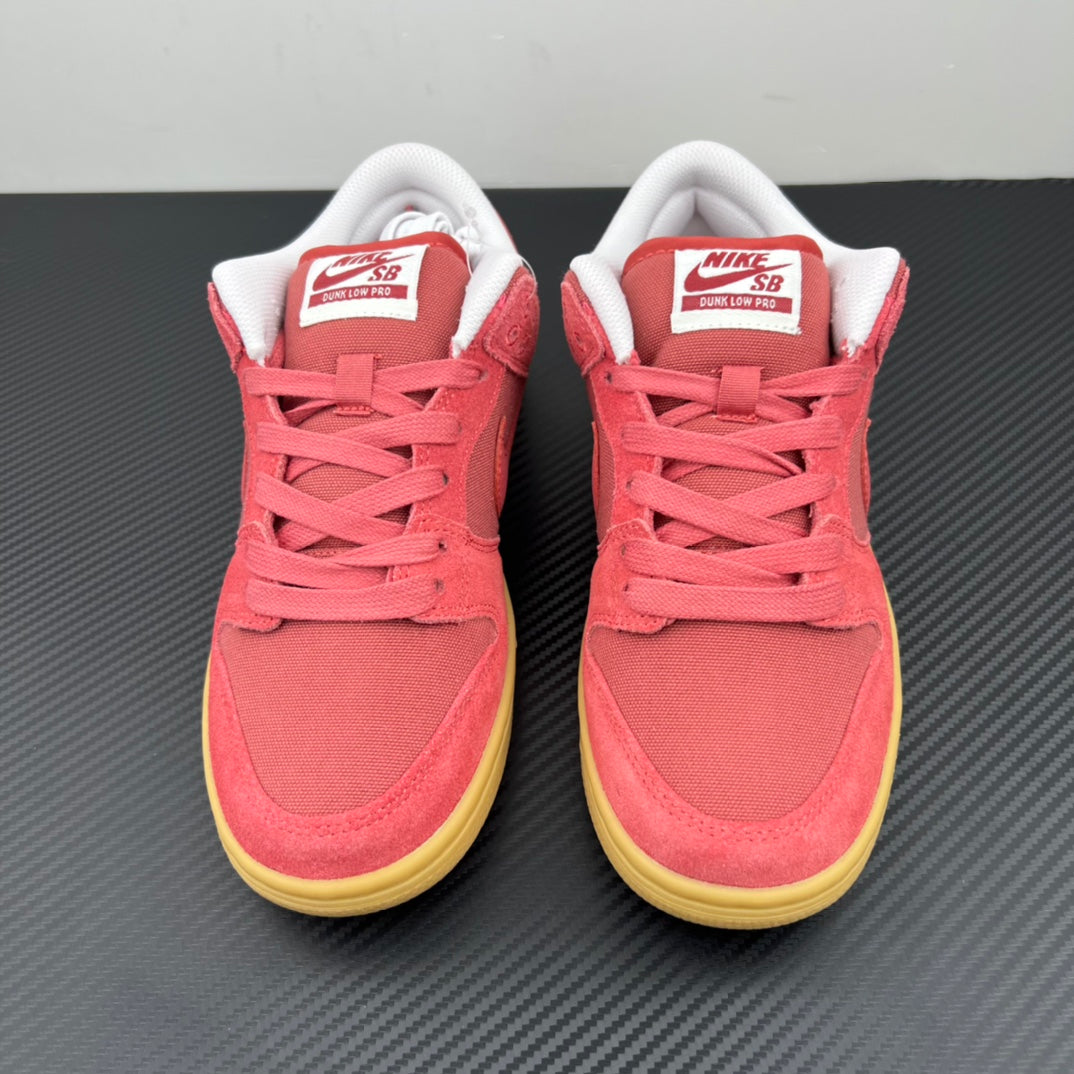 Pair of low-top sneakers with pink suede, white heel collars, and yellow soles