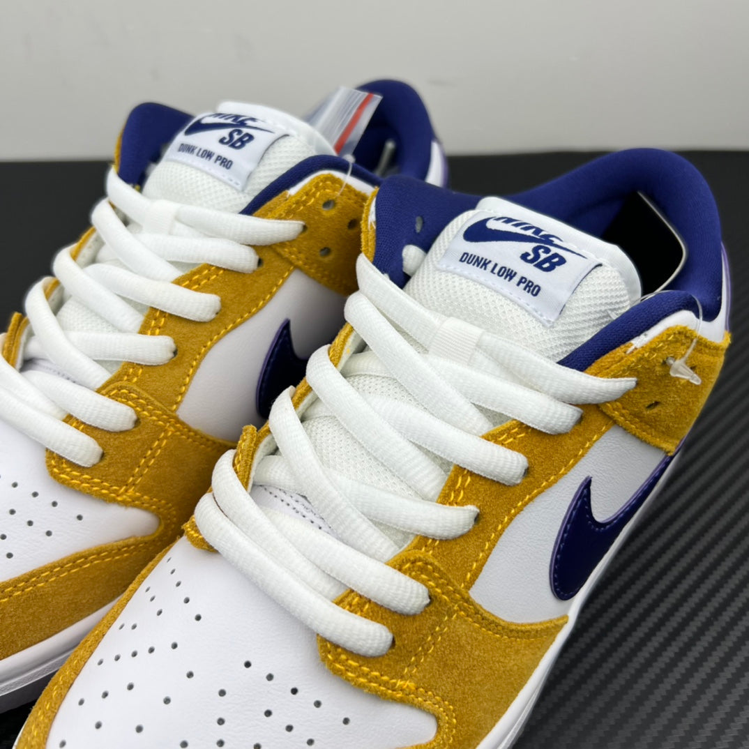 Nike Dunk SB Low Pro sneakers, top view of tongues and laces in white, gold and navy