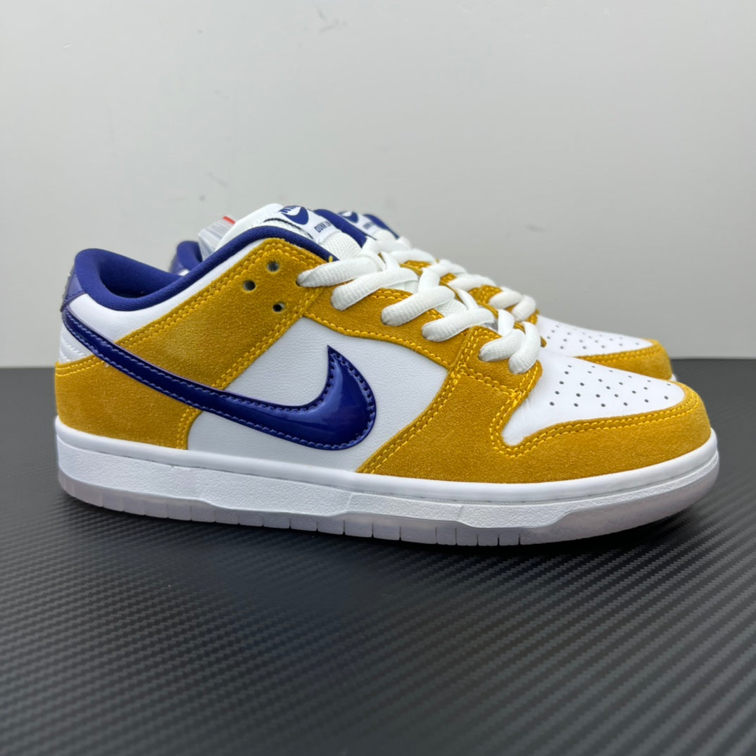 Nike Dunk SB Low Pro low-top sneakers in white, gold and navy, with white laces