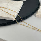 Gucci pendant necklace with fine gold chain and small round logo charm