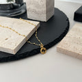 Gucci pendant necklace with gold chain and small round logo charm