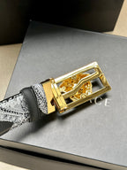 Versace belt buckle close-up with gold-tone finish and Medusa emblem