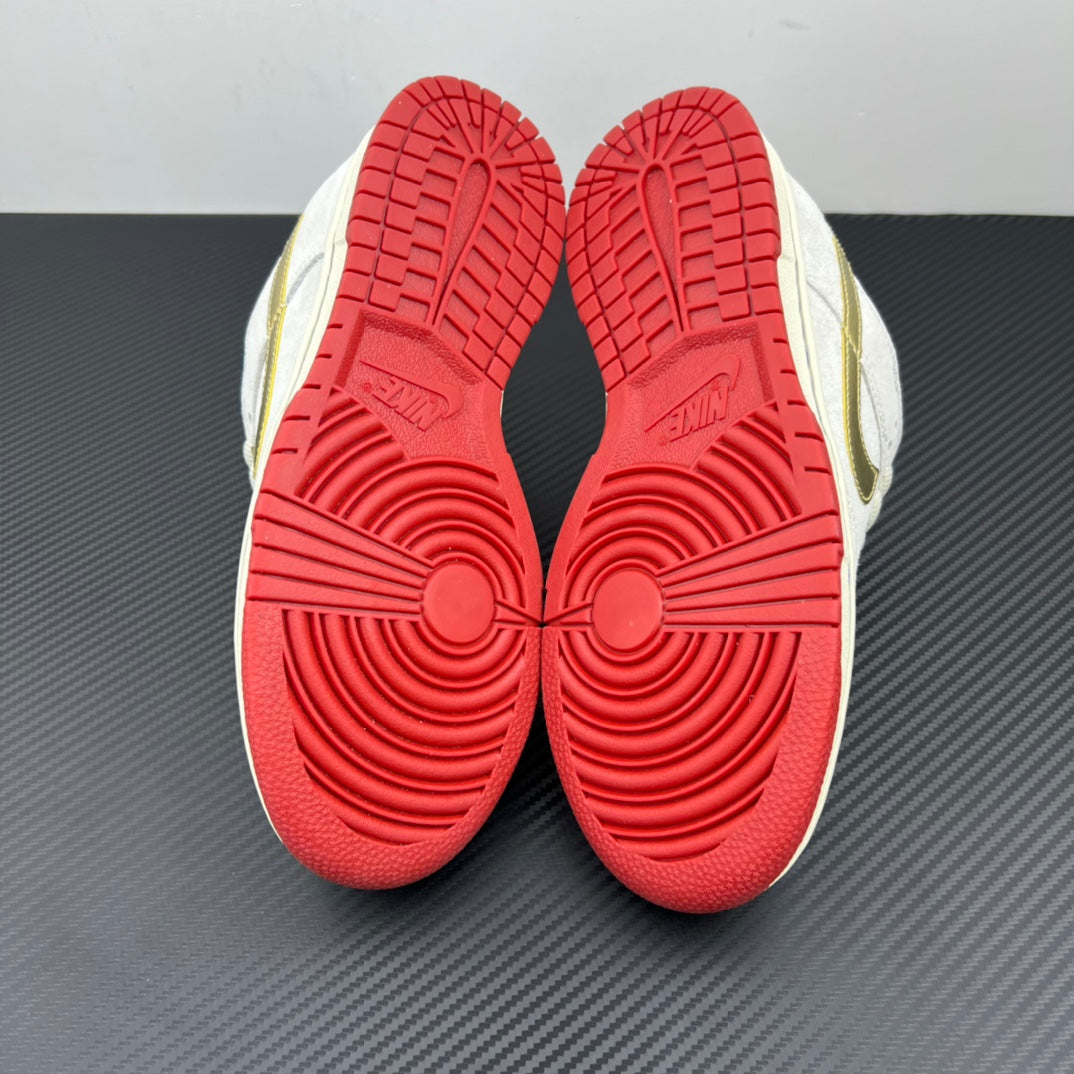 Shoe outsoles in red with circular tread pattern on white and navy sneakers.