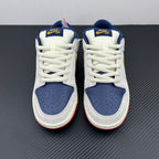 Pair of low-top sneakers with white uppers, navy perforated toe boxes, blue collars.