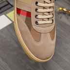 Burberry suede sneaker close-up: beige laces with black-and-white check and red stripe detail