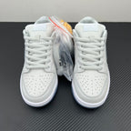 White low-top sneakers, lace-up pair shown from front with protective plastic wrap.