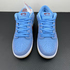 Pair of light blue low-top sneakers with blue laces and maroon tongue branding