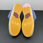 Pair of light blue sneakers with yellow gum outsoles and patterned traction