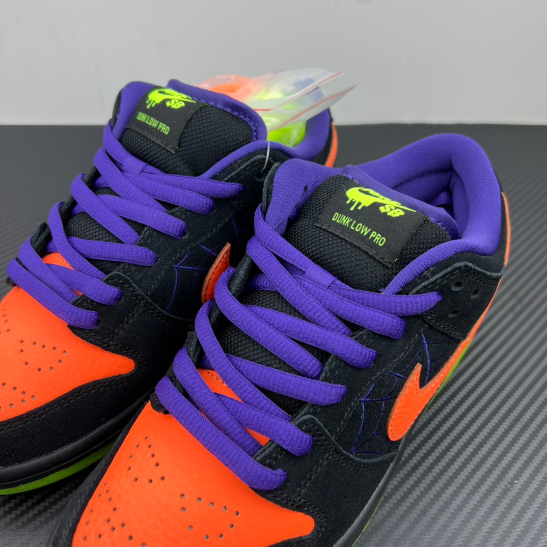 Pair of low-top sneakers, black uppers with purple laces and orange swooshes, neon green sole.