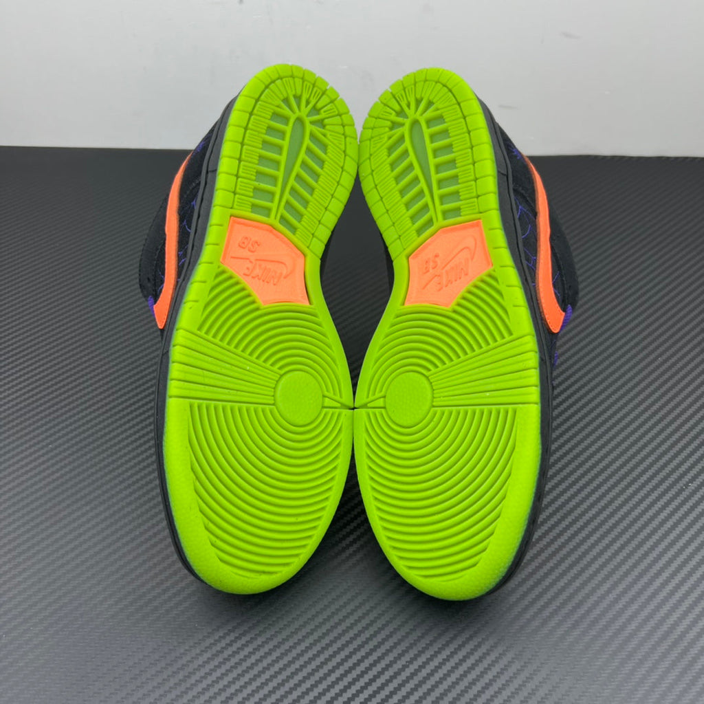 Sneaker outsole underside with neon green tread and orange side details.