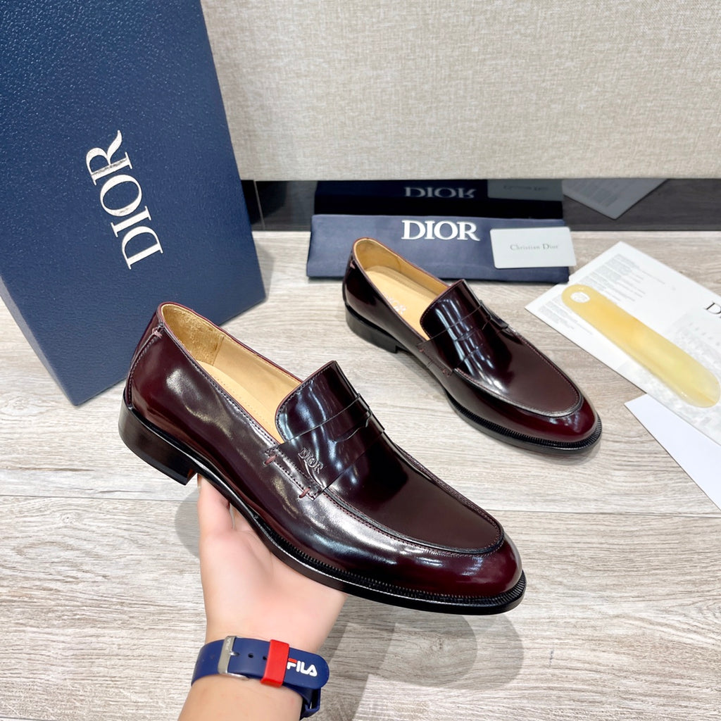 Dior unisex patent leather loafer pair, dark burgundy slip-on with strap
