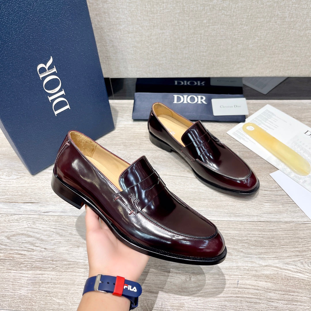 Dior unisex patent leather loafer pair, dark burgundy slip-on with strap