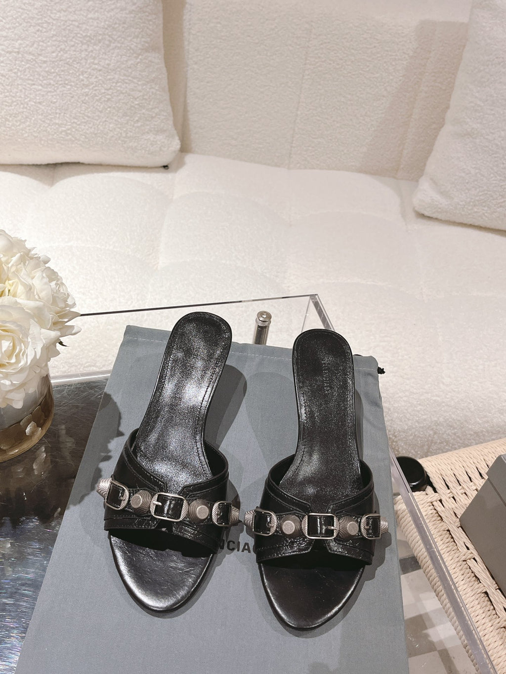 Black leather slide sandals with square-toe straps and silver buckle hardware