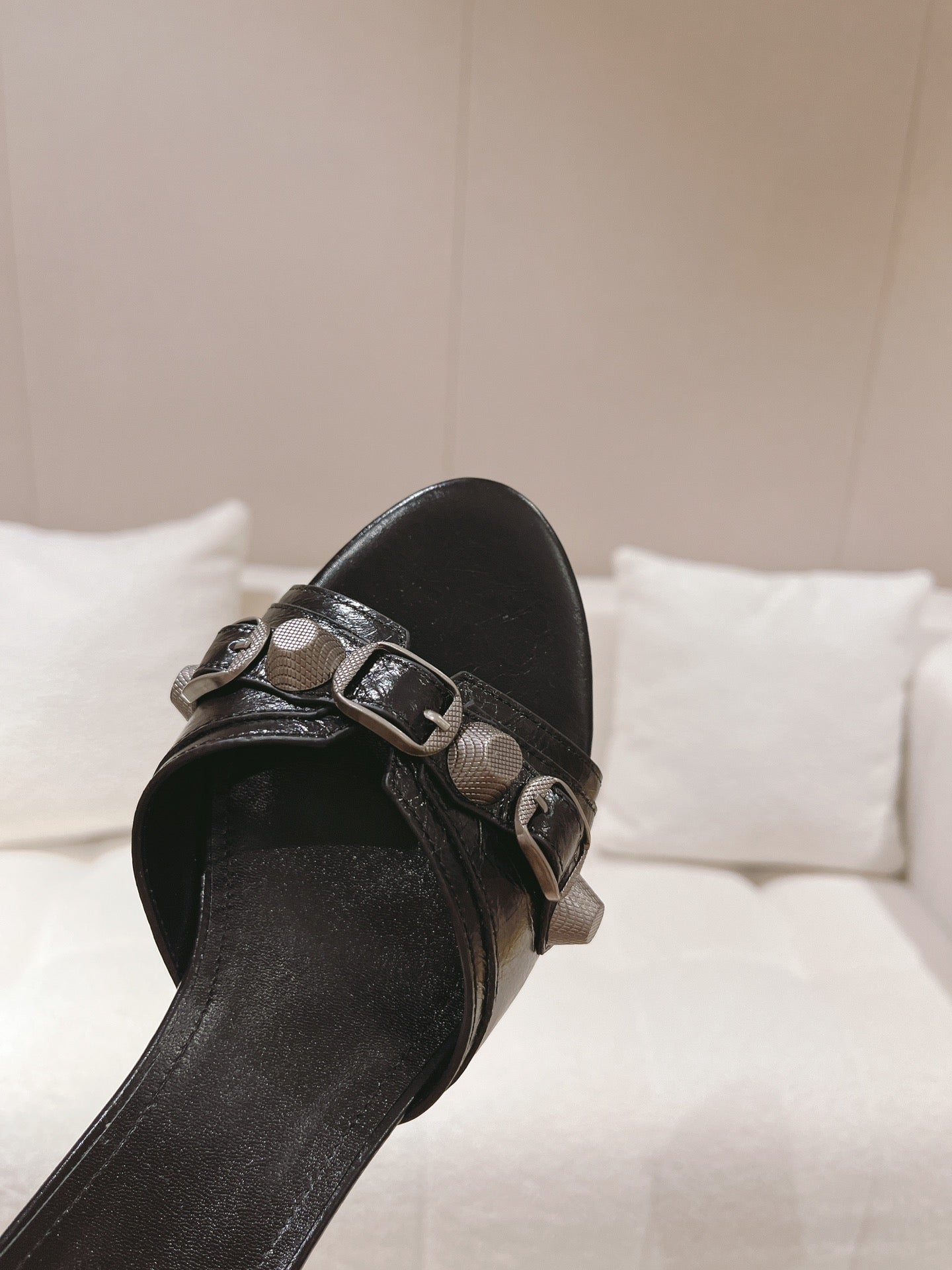 Black leather slide sandal upper with silver buckle and textured strap panel