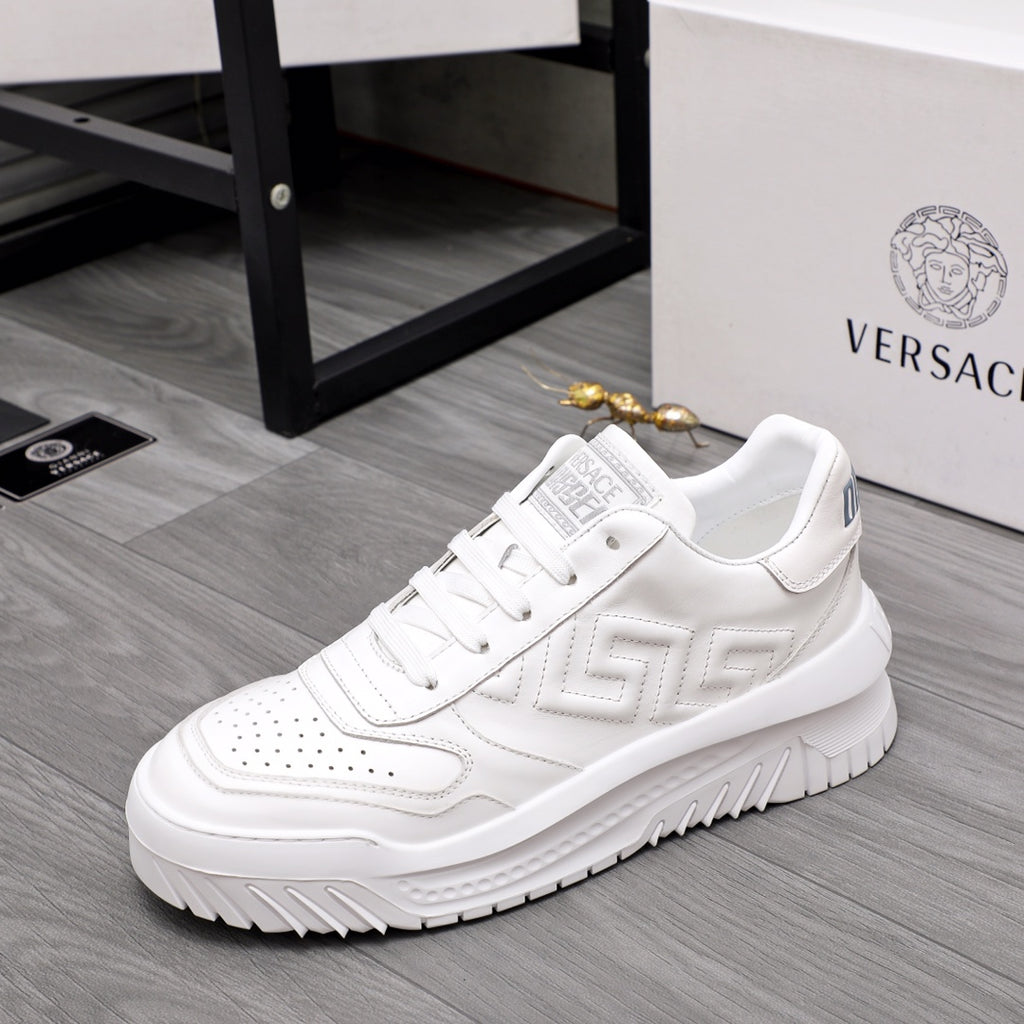 Versace white leather sneakers, side view with textured logo panel