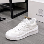 Versace white leather sneakers, side view with textured logo panel