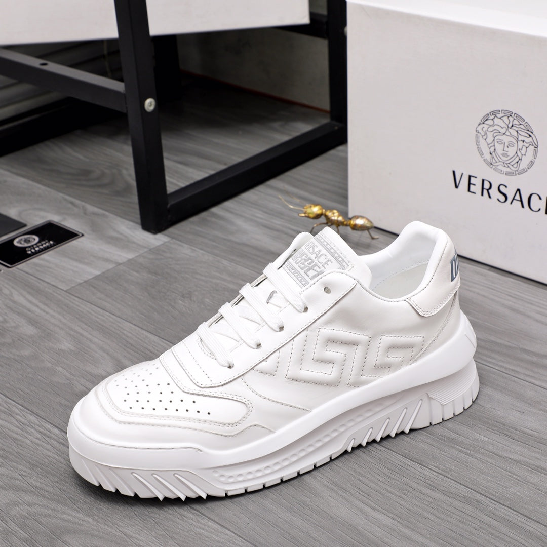 Versace white leather sneakers, side view with textured logo panel
