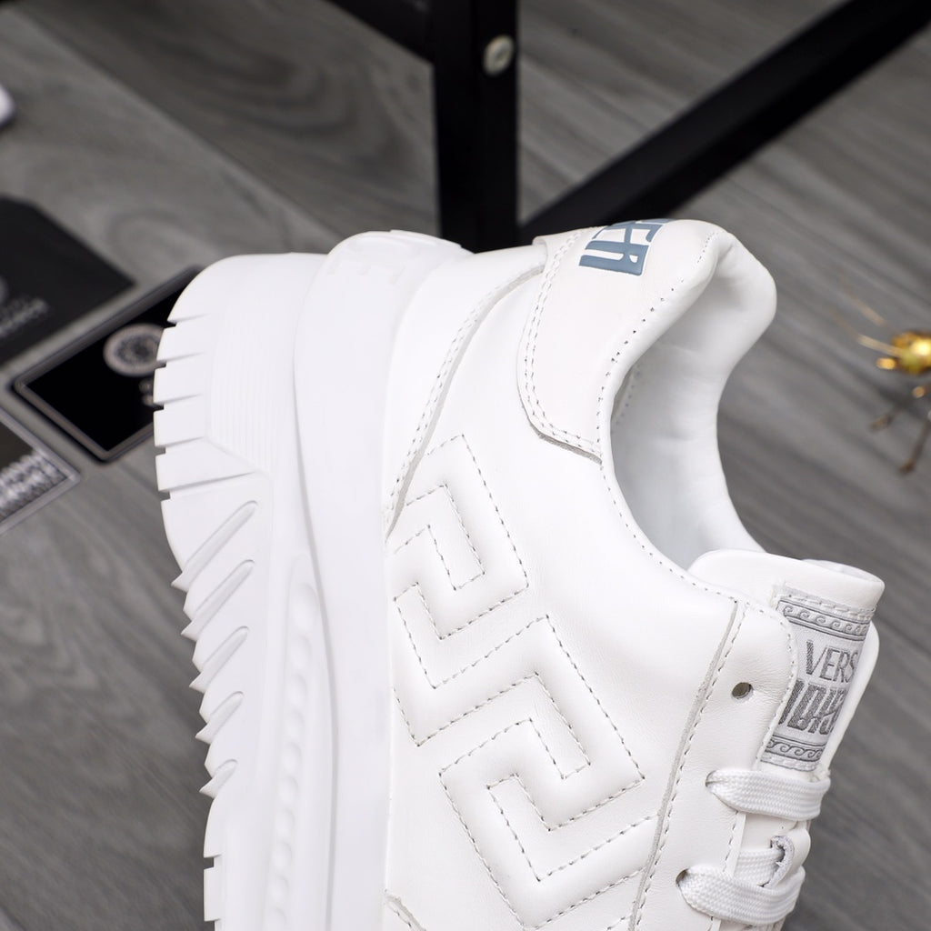 Versace white leather sneaker, quarter view with zigzag logo embossing