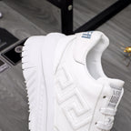 Versace white leather sneaker, quarter view with zigzag logo embossing
