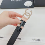 Light pink belt end and black strap with rhinestone buckle clasp