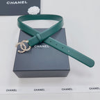 Green Chanel belt with ornate gold and pearl buckle detail, strap looped