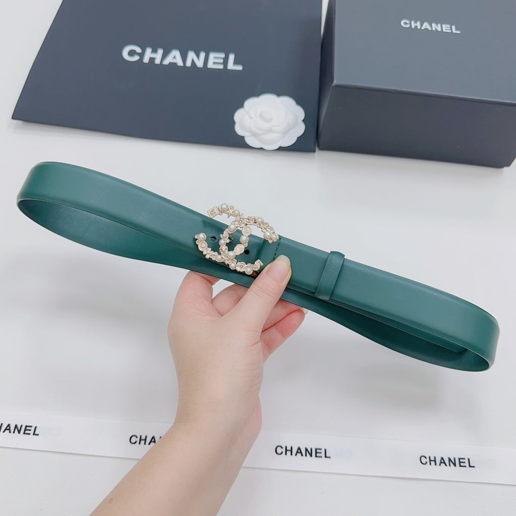 Green leather Chanel belt with ornate gold and pearl buckle