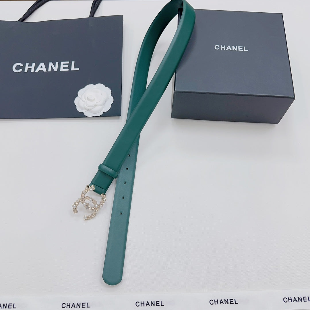 Green Chanel belt with gold and pearl buckle, long strap and keeper shown