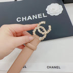 Beige Chanel belt strap and gold-tone jeweled buckle with faux pearls