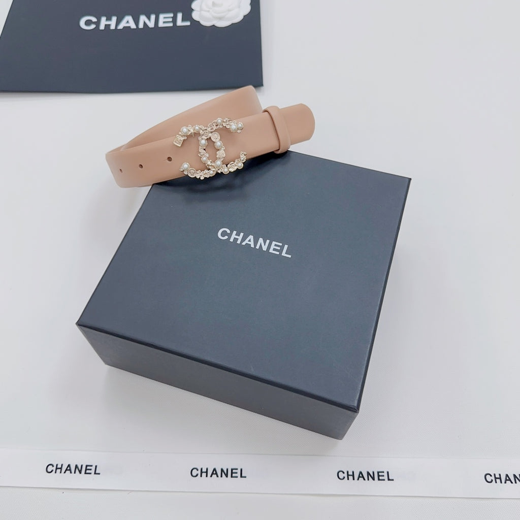Beige Chanel belt with ornate jeweled buckle, shown with gift box