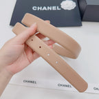 Beige Chanel belt strap with adjustable punched holes, showing strap pair