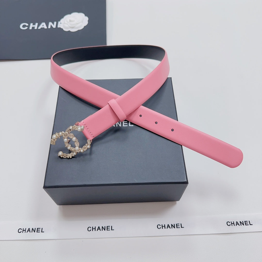 Pink leather belt with gold crown ornament and adjustable holes