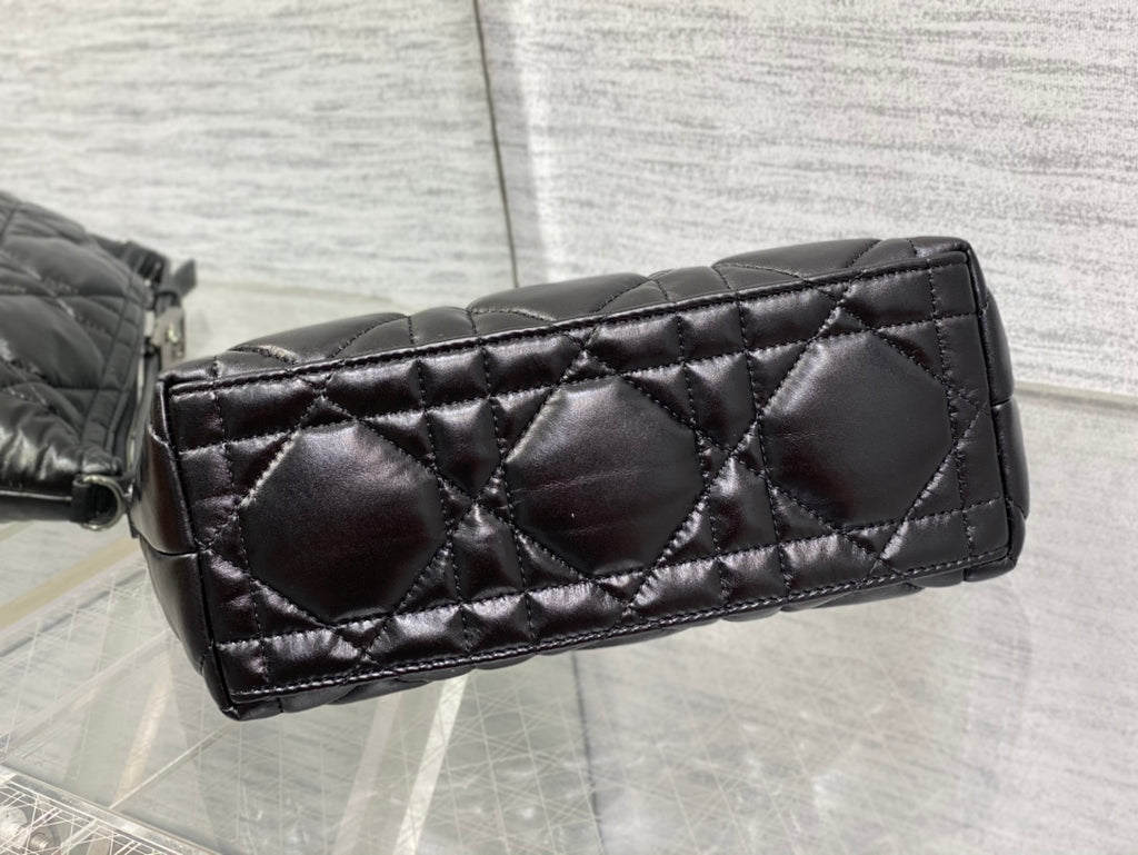 Quilted black Dior bag side panel with diamond stitching and structured base