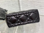 Quilted black Dior bag side panel with diamond stitching and structured base