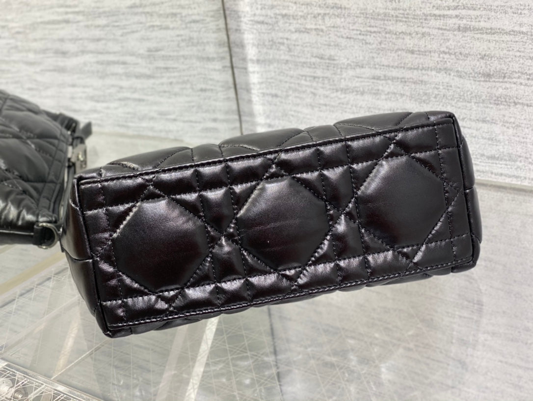 Quilted black Dior bag side panel with diamond stitching and structured base