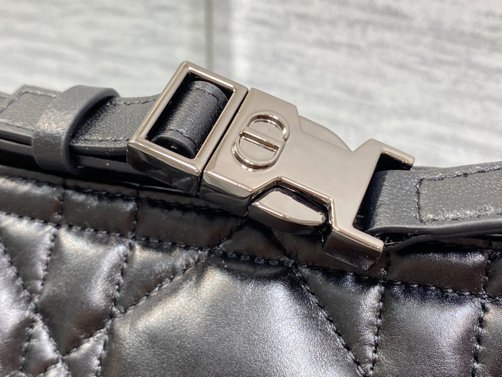 Quilted black Dior bag strap with metal buckle and clasp hardware
