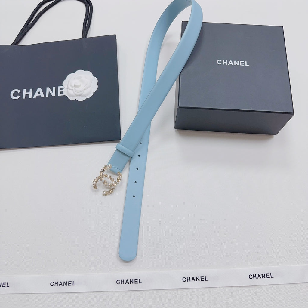 Light blue leather belt with gold embellished buckle and long strap