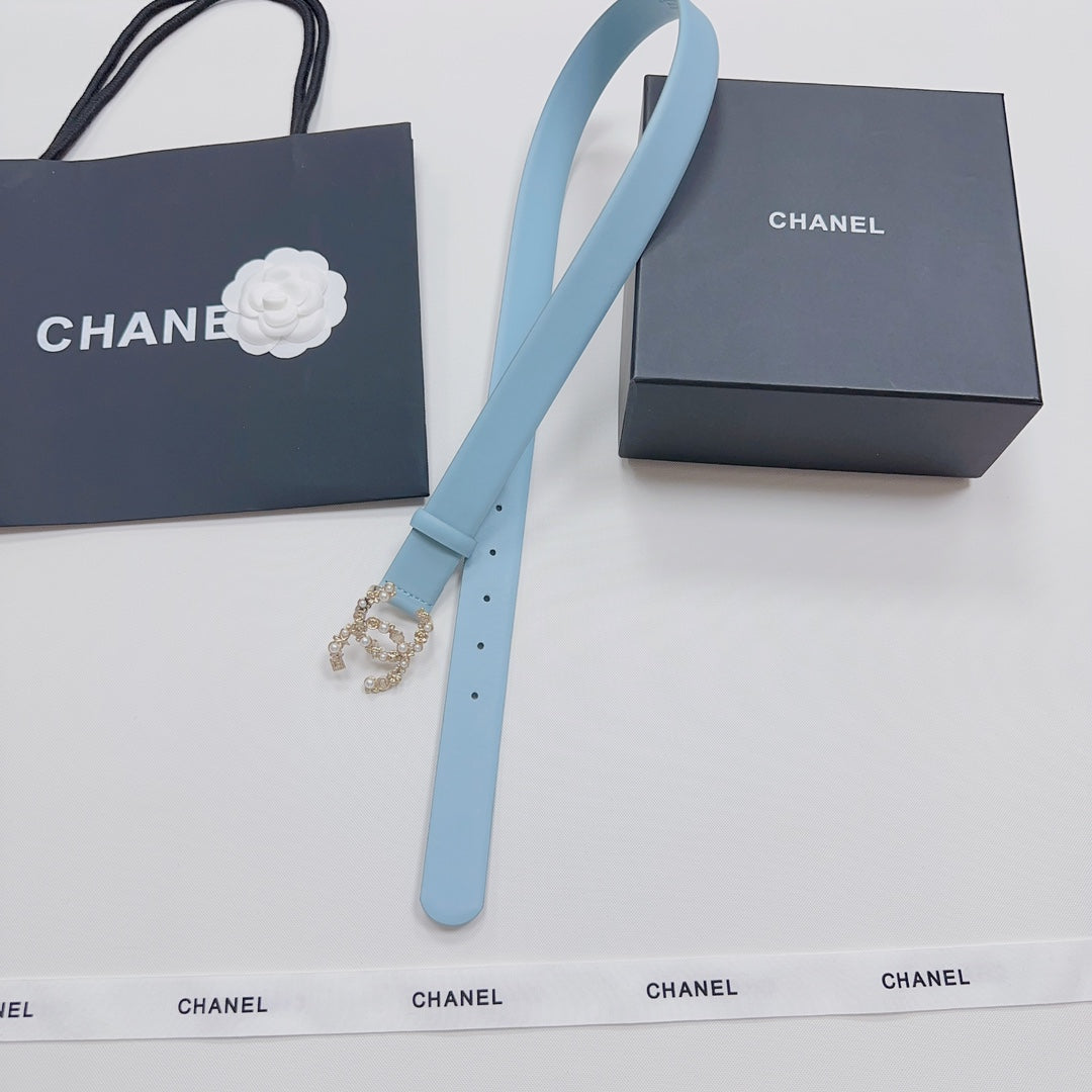Light blue leather belt with gold embellished buckle and long strap