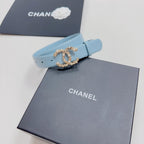 Light blue belt with gold-toned embellished buckle and pin holes