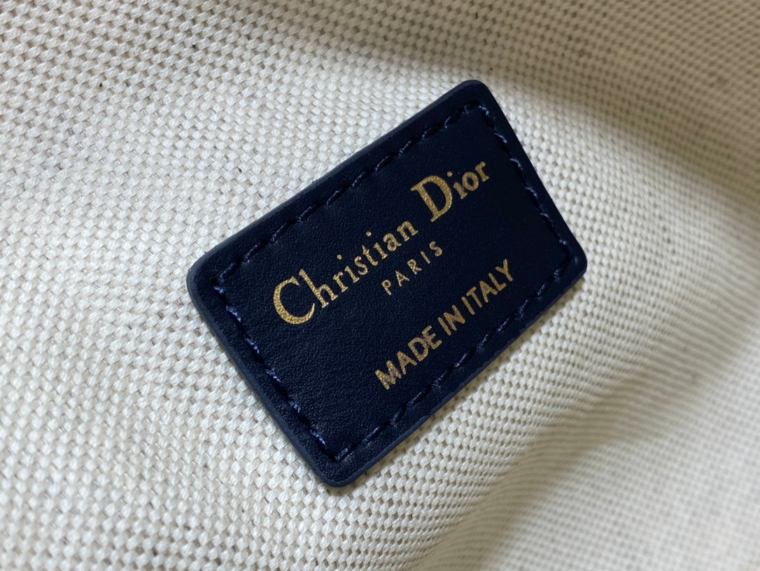 Dior bag leather label patch with gold text, including "Made in Italy"