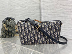 Dior crossbody bag with Dior monogram pattern and navy leather-look strap, gold hardware