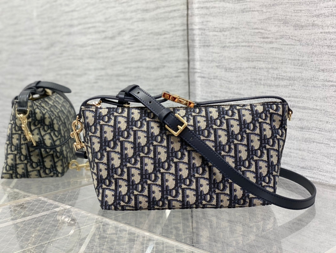 Dior crossbody bag in navy-and-cream Dior print canvas with navy leather strap