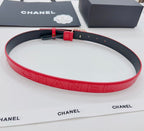 Chanel red quilted leather belt with embossed CHANEL lettering and gold buckle