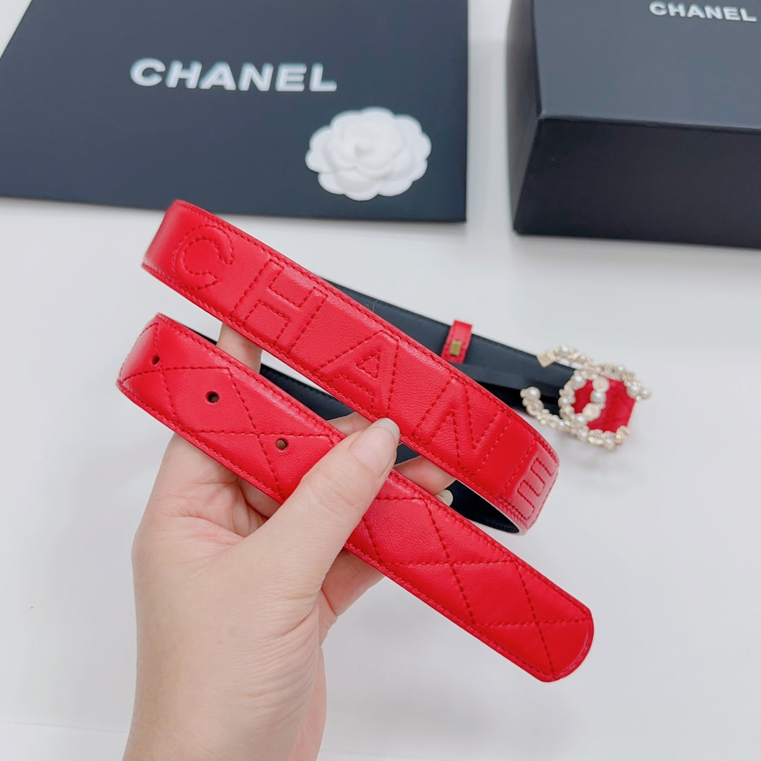 Chanel red quilted leather belt with embossed pattern, holes, and gold buckle