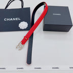 Chanel red leather belt with gold-tone decorative buckle and punched adjustment holes