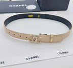 Beige Chanel belt with gold buckle, rhinestone CC floral ornament, black lining