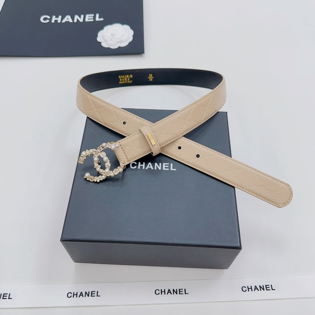 Beige Chanel belt with gold buckle, rhinestone CC floral applique on black-lined strap