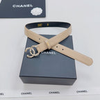 Beige Chanel belt with gold buckle, rhinestone CC floral applique on black-lined strap
