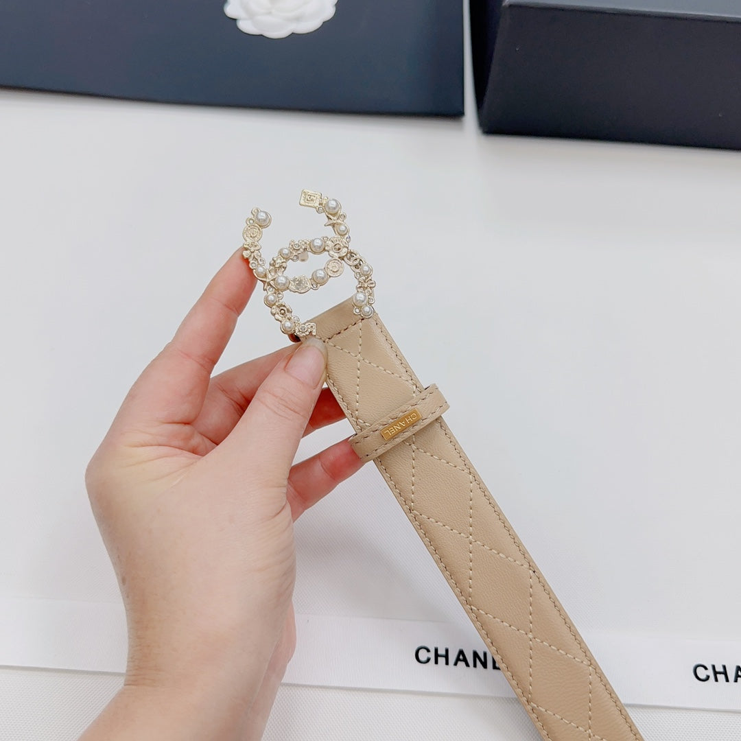 Beige Chanel belt strap with rhinestone CC ornament and gold buckle detail