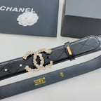 Chanel belt close-up: dark quilted leather with gold buckle and pearl bead chain centerpiece
