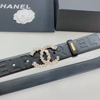 Chanel belt detail: dark blue embossed strap with gold-tone buckle and pearl-like interlock
